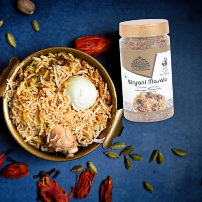Earthspice Biryani masala spice jar next to a bowl of biryani.