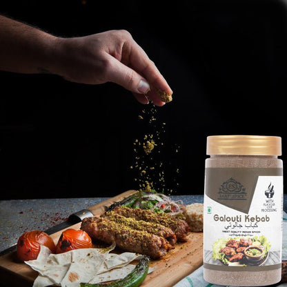 Hand sprinkling spices with Earthspice Galouti Kebab spice