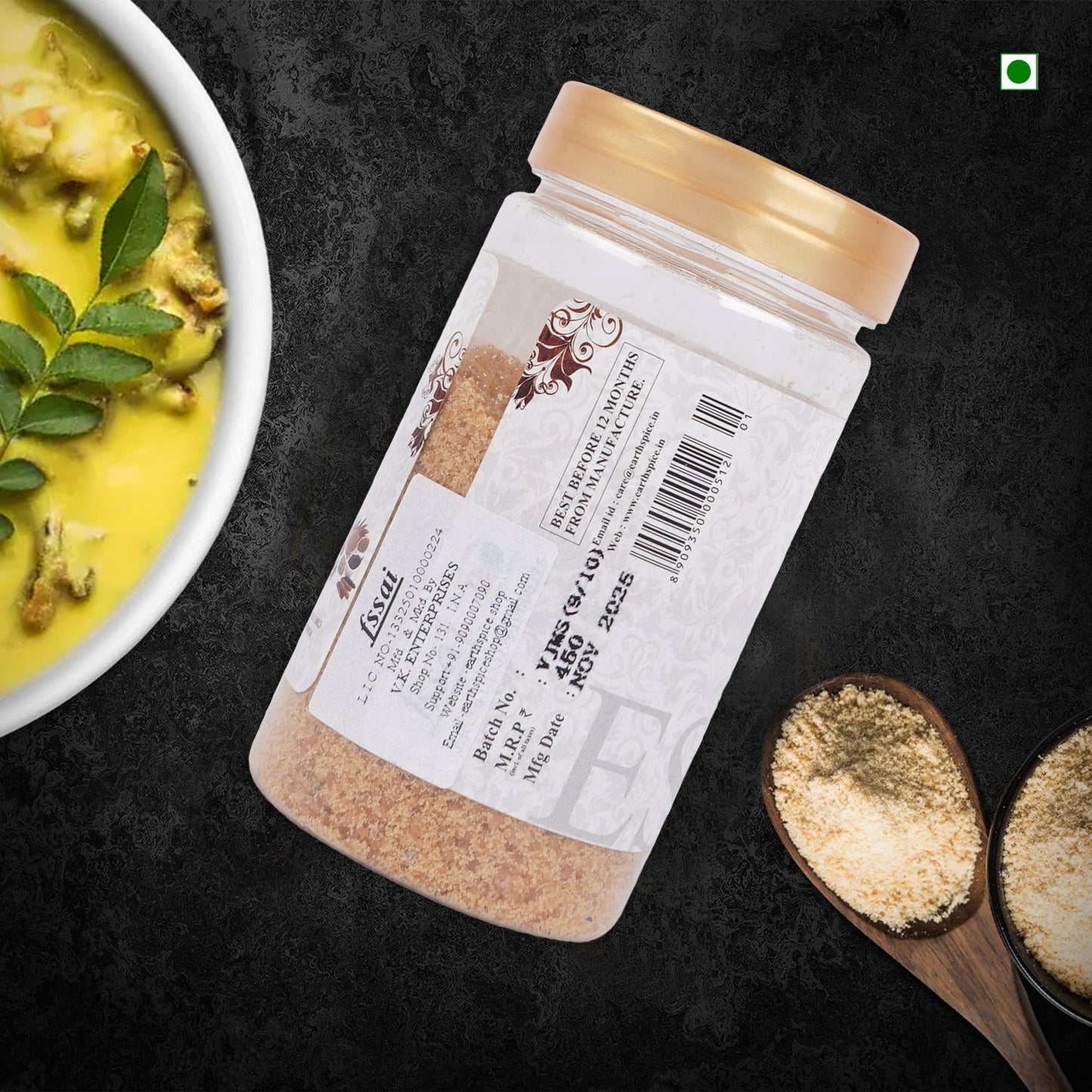 Earthspice hing asafoetida with label on a dark surface.